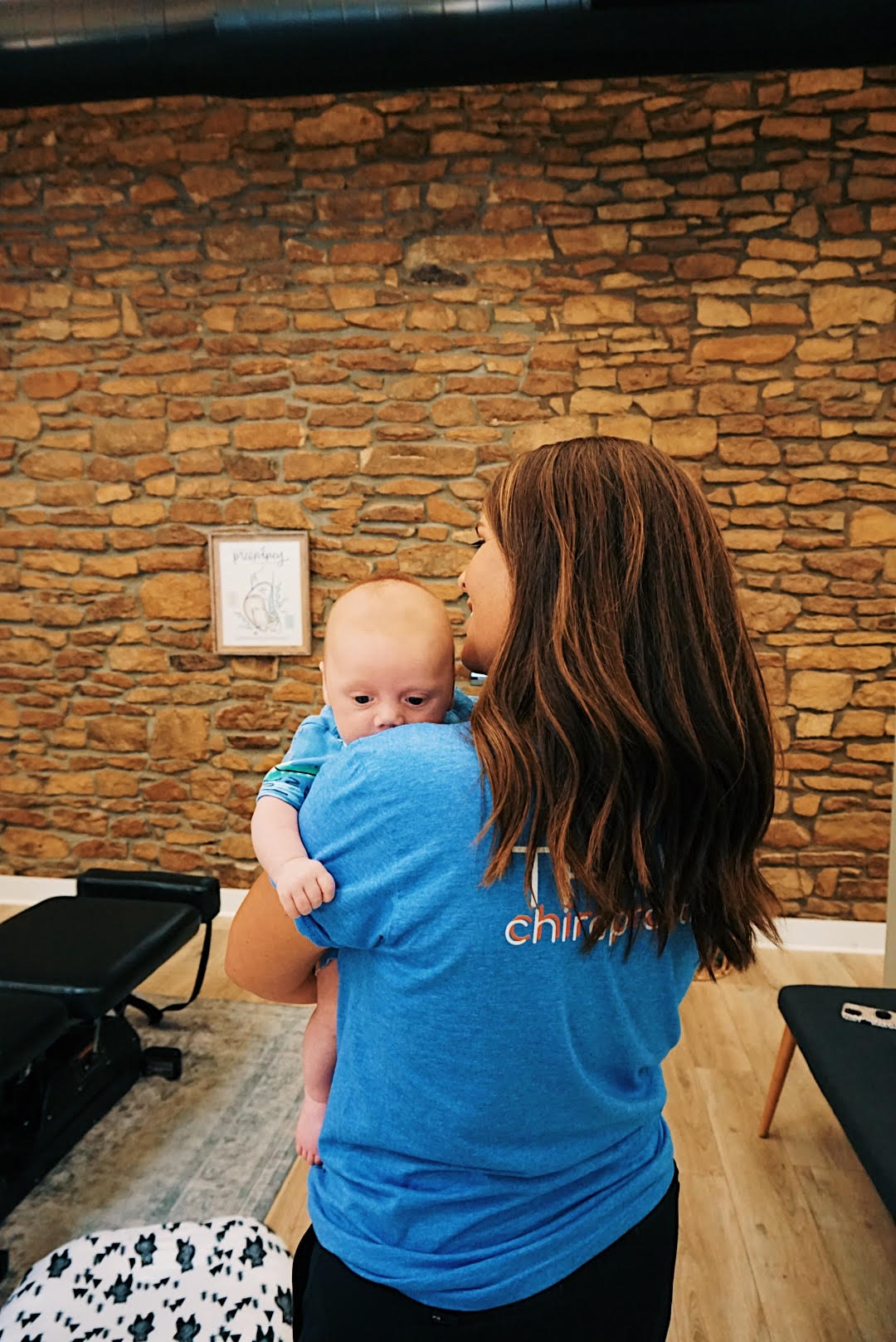 Topeka pediatric chiropractor providing gentle loving care to infant patient - specialized techniques for babies and children