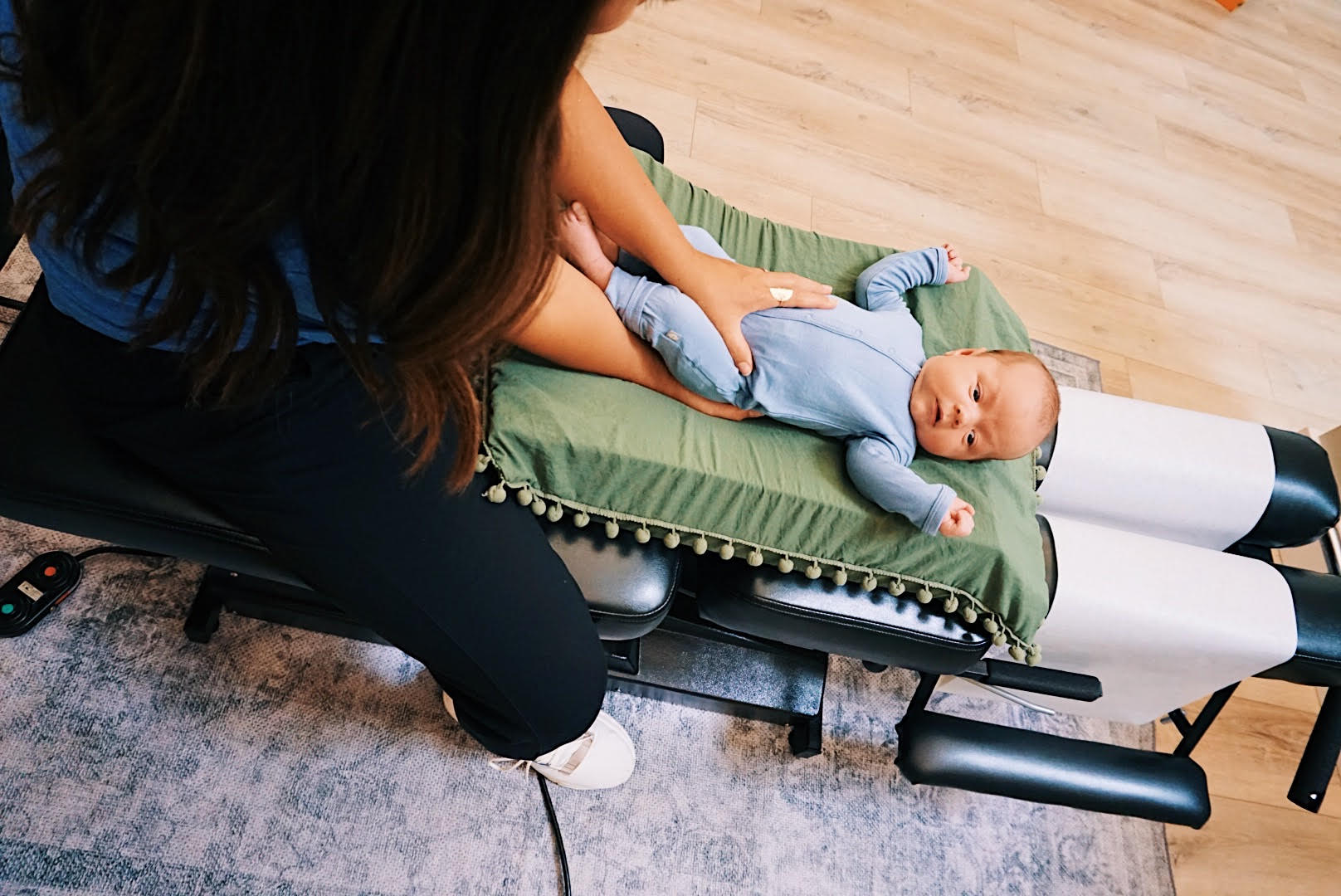 Gentle infant chiropractic adjustment in Topeka - safe comfortable positioning for newborn nervous system care