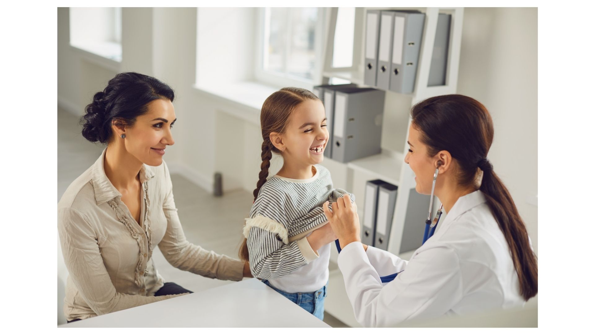 Topeka family chiropractor caring for mother and child at Thrive Chiropractic
