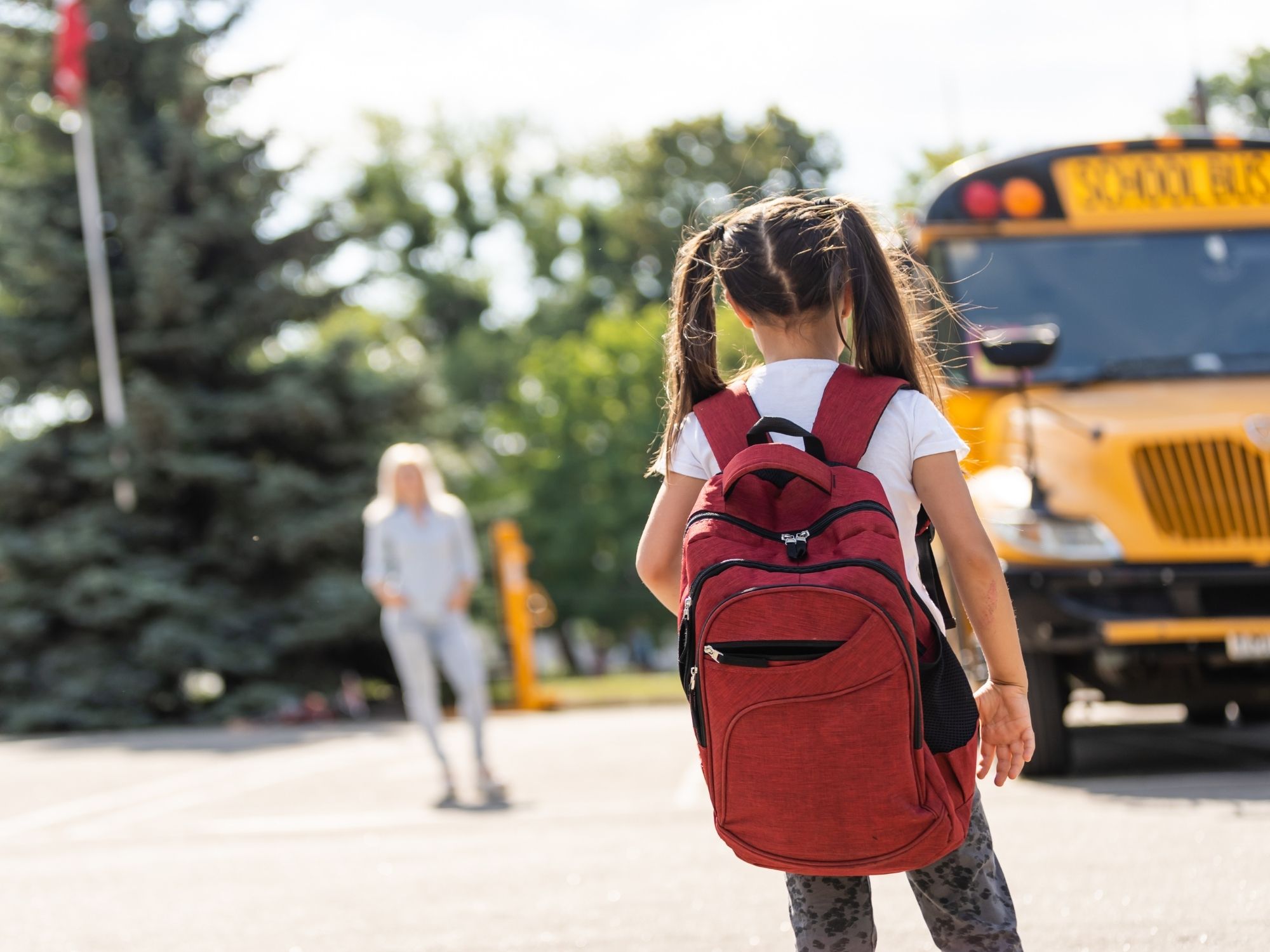 Child with backpack heading to school in Topeka - pediatric chiropractic supports kids through school year challenges